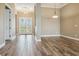 Open-concept living room with tile flooring, neutral paint, and view of the front entry at 170 Antilla Dr, Rotonda West, FL 33947