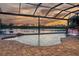Beautiful pool with a waterfall feature and a serene lake view, perfect for relaxation and entertainment at 170 Antilla Dr, Rotonda West, FL 33947