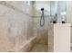 Tiled shower with built-in bench seating, providing a spa-like experience at 170 Antilla Dr, Rotonda West, FL 33947