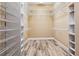 Walk-in closet featuring custom shelving, providing ample storage space at 170 Antilla Dr, Rotonda West, FL 33947