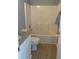 Bathroom features a shower-tub combo with white tiling and a granite vanity top at 1708 Blue Lake Cir, Punta Gorda, FL 33983