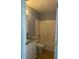 Bathroom features a shower-tub combo with white tiling and a granite vanity top at 1708 Blue Lake Cir, Punta Gorda, FL 33983