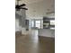 Open-concept living room featuring wainscotting, wood floors, a chandelier, and lots of natural light at 1708 Blue Lake Cir, Punta Gorda, FL 33983