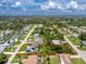 Expansive aerial view highlighting a property's boundaries and its position within the wider community at 18147 Brazil Ave, Port Charlotte, FL 33948