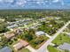 Beautiful aerial view of a single-Gathering home with lush landscaping and a spacious lot outlined in red at 18147 Brazil Ave, Port Charlotte, FL 33948