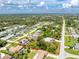 Sweeping aerial perspective showcasing a property's location in a lush neighborhood with easy access to amenities at 18147 Brazil Ave, Port Charlotte, FL 33948