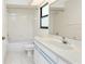 Full bathroom featuring a shower-tub combination, vanity, and tile floors at 18147 Brazil Ave, Port Charlotte, FL 33948
