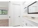 Bathroom featuring neutral color palette, marble countertop, and natural light at 18147 Brazil Ave, Port Charlotte, FL 33948