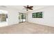 Spacious bedroom with a ceiling fan and a sliding glass door leading to a patio at 18147 Brazil Ave, Port Charlotte, FL 33948