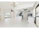 Modern kitchen with white cabinets, stainless steel appliances, and seamless connection to living spaces and the pool at 18147 Brazil Ave, Port Charlotte, FL 33948