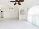 The open-concept living area features tile floors, high ceilings, and natural light, perfect for entertaining or relaxing at 18147 Brazil Ave, Port Charlotte, FL 33948