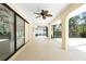 Spacious screened patio with ceiling fan, providing a comfortable outdoor living space at 18147 Brazil Ave, Port Charlotte, FL 33948