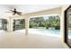 Covered patio overlooking a backyard swimming pool and lush landscaping at 18147 Brazil Ave, Port Charlotte, FL 33948