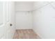 Walk-in closet features built-in shelving for optimal storage solutions at 18147 Brazil Ave, Port Charlotte, FL 33948