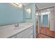 This bathroom features a white vanity and mirrored closet doors at 19505 Quesada Ave # Tt101, Port Charlotte, FL 33948