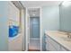 Bathroom featuring a white vanity, stackable washer and dryer, and tiled floors at 19505 Quesada Ave # Tt101, Port Charlotte, FL 33948