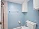 Tiled bathroom with white fixtures and blue accent wall at 19505 Quesada Ave # Tt101, Port Charlotte, FL 33948