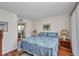 Cozy bedroom with wood floors and ample natural light at 19505 Quesada Ave # Tt101, Port Charlotte, FL 33948