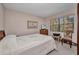A cozy bedroom has a window, dresser, and neutral decor at 19505 Quesada Ave # Tt101, Port Charlotte, FL 33948