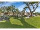 Well-maintained common area with picnic benches and lush landscaping offers a relaxing community space at 19505 Quesada Ave # Tt101, Port Charlotte, FL 33948