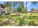 Grassy common area featuring a picnic table and charcoal grill at 19505 Quesada Ave # Tt101, Port Charlotte, FL 33948