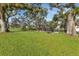 Lush community park offering benches and picnic tables under mature trees at 19505 Quesada Ave # Tt101, Port Charlotte, FL 33948