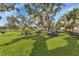 Community park featuring shady trees, picnic tables and barbecue grills at 19505 Quesada Ave # Tt101, Port Charlotte, FL 33948
