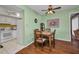 Dining area with table, chairs, and an open view into kitchen space at 19505 Quesada Ave # Tt101, Port Charlotte, FL 33948