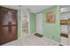 Bright entryway with tiled floors, closet, and doorway to the bathroom at 19505 Quesada Ave # Tt101, Port Charlotte, FL 33948