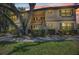Condo exterior with lush landscaping, mature trees, and a serene setting at sunset at 19505 Quesada Ave # Tt101, Port Charlotte, FL 33948