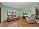 Cozy living room with wood floors, and comfortable seating creating an inviting space at 19505 Quesada Ave # Tt101, Port Charlotte, FL 33948