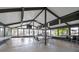 A community meeting room filled with tables and chairs, ceiling fans, and views through a wall of windows at 19505 Quesada Ave # Tt101, Port Charlotte, FL 33948