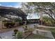 Outdoor patio area with picnic tables and lush landscaping, creating a serene environment at 19505 Quesada Ave # Tt101, Port Charlotte, FL 33948