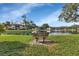 Scenic pond view from a bench, enhancing the serene atmosphere of the community at 19505 Quesada Ave # Tt101, Port Charlotte, FL 33948
