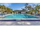 Large rectangular pool with clear water and ample deck space for lounging at 19505 Quesada Ave # Tt101, Port Charlotte, FL 33948