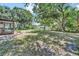 Large backyard featuring a screened-in patio with outdoor furniture at 2131 Amanda Dr, Sarasota, FL 34232