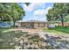 A spacious, green backyard featuring a screened-in patio at 2131 Amanda Dr, Sarasota, FL 34232