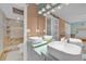 Elegant bathroom with double vessel sinks, modern vanity, and separate tiled shower at 2131 Amanda Dr, Sarasota, FL 34232
