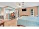 Bright bedroom featuring a mini bar, tiled flooring, and a calming color palette at 2131 Amanda Dr, Sarasota, FL 34232