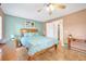 Bedroom with a queen-size bed, a bedside table, and tile flooring with warm tones at 2131 Amanda Dr, Sarasota, FL 34232