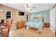Bedroom featuring tiled flooring, and ensuite bathroom, accented by soothing color palette at 2131 Amanda Dr, Sarasota, FL 34232