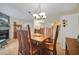 Dining room featuring a wood table, chairs, and overhead lighting fixture with a fireplace at 2131 Amanda Dr, Sarasota, FL 34232