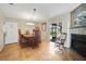 Inviting dining room with fireplace, neutral paint, dining set, and access to outdoor seating at 2131 Amanda Dr, Sarasota, FL 34232