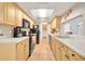 Bright kitchen with ample cabinetry, modern appliances, and a view of the laundry area at 2131 Amanda Dr, Sarasota, FL 34232