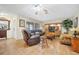 Comfortable living room features tile floors, large window, and ceiling fan at 2131 Amanda Dr, Sarasota, FL 34232