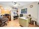 Office with a ceiling fan, ample shelving, and a window with natural light at 2131 Amanda Dr, Sarasota, FL 34232