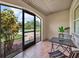 Screened in patio with tile floor and an outside view at 2131 Amanda Dr, Sarasota, FL 34232