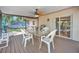 Covered patio with a fan, table and seating, and a grill at 2131 Amanda Dr, Sarasota, FL 34232