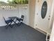 Enclosed patio area featuring outdoor seating next to the front door at 2131 Amanda Dr, Sarasota, FL 34232