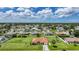 Aerial view showcases an expansive lot and serene neighborhood at 23141 Corvin Ave, Port Charlotte, FL 33954